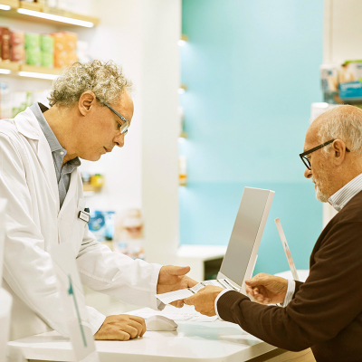 man talking to pharmacist