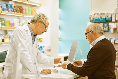 man talking to pharmacist